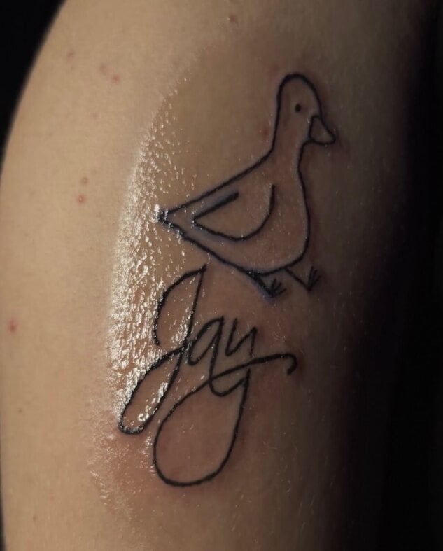 A simple single-line bird perched above a name in script